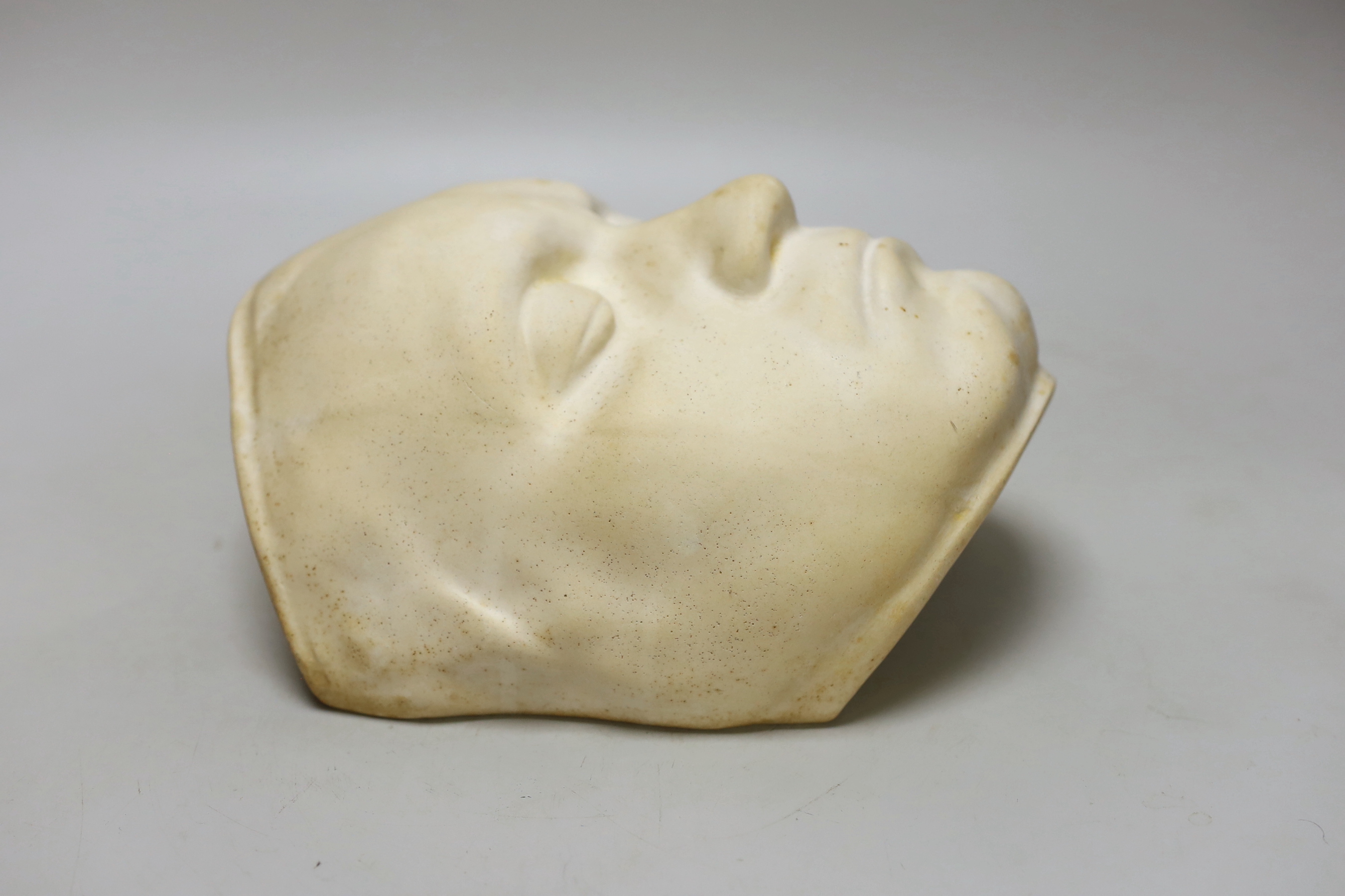 A plaster death mask, approximately 23cm high